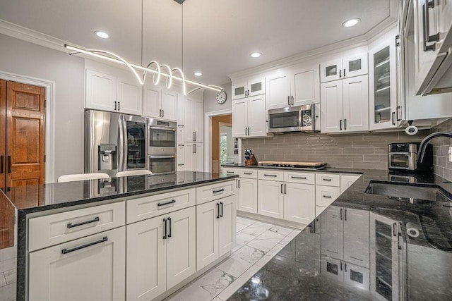 117 Cidar Ln, Peters Twp, PA 15317 - kitchen with stainless steel appliances, light marble finish floors, white cabinets, a kitchen island, and recessed lighting