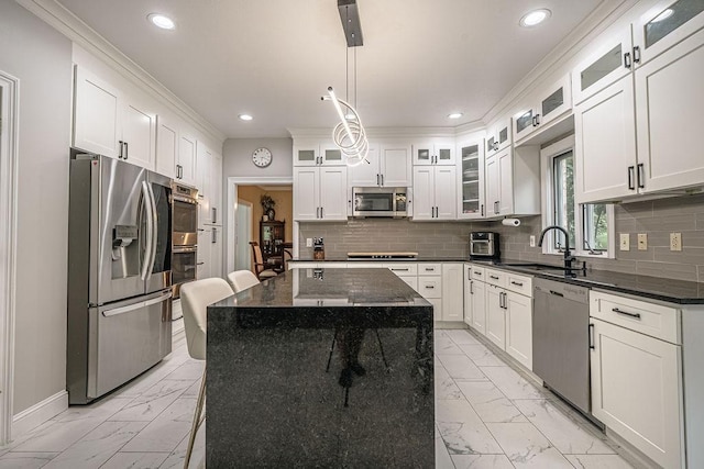 117 Cidar Ln, Peters Twp, PA 15317 - kitchen with stainless steel appliances, light marble finish floors, crown molding, recessed lighting, and a center island
