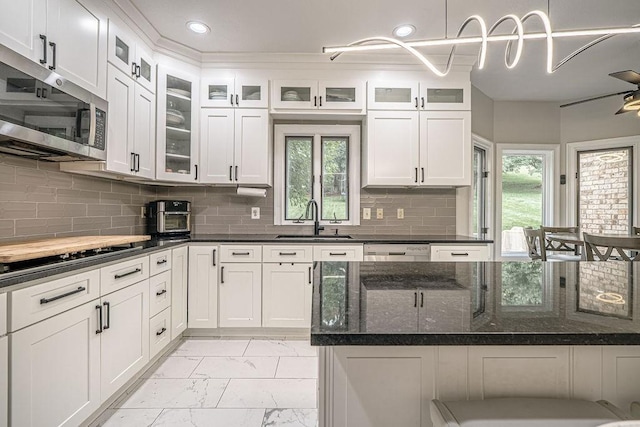 117 Cidar Ln, Peters Twp, PA 15317 - kitchen with stainless steel microwave, light marble finish flooring, black electric cooktop, white cabinets, and dark stone countertops