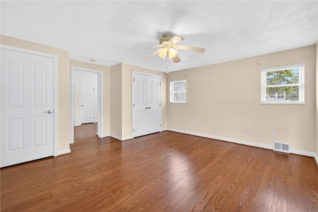 228 Mcmasters Dr, Monroeville, PA 15146 - unfurnished bedroom with wood finished floors, a ceiling fan, and a closet