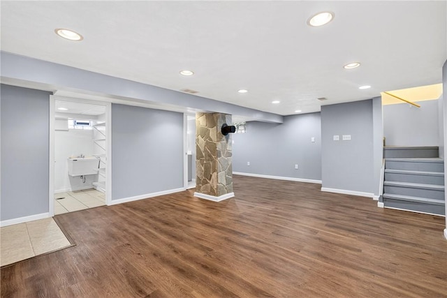 228 Mcmasters Dr, Monroeville, PA 15146 - finished basement featuring stairway, wood finished floors, and recessed lighting