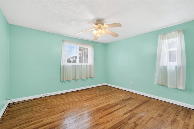 228 Mcmasters Dr, Monroeville, PA 15146 - empty room with hardwood / wood-style floors, ceiling fan, and a textured ceiling