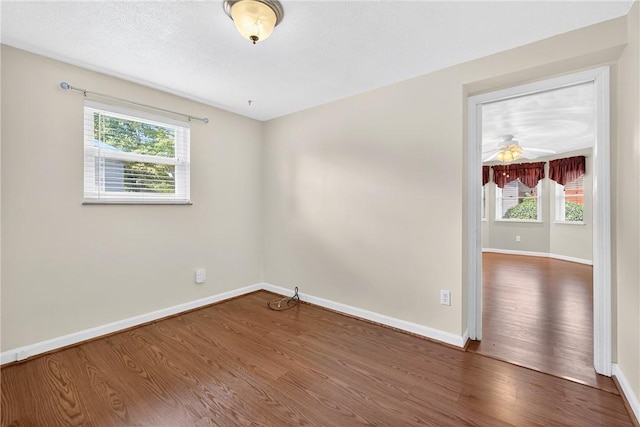 228 Mcmasters Dr, Monroeville, PA 15146 - unfurnished room with wood finished floors, plenty of natural light, and ceiling fan