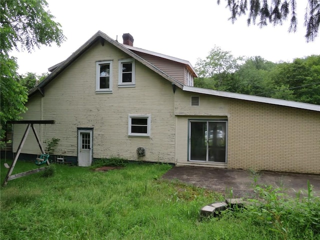 60 Wisetown Rd, Pa, PA 15022 - back of property featuring a chimney and a patio