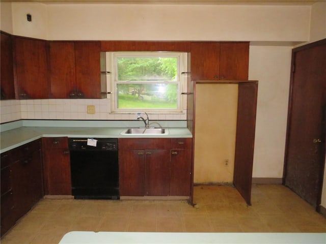 60 Wisetown Rd, Pa, PA 15022 - kitchen featuring black dishwasher, light countertops, and tasteful backsplash
