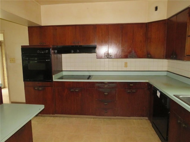 60 Wisetown Rd, Pa, PA 15022 - kitchen with black appliances, ventilation hood, light countertops, and decorative backsplash