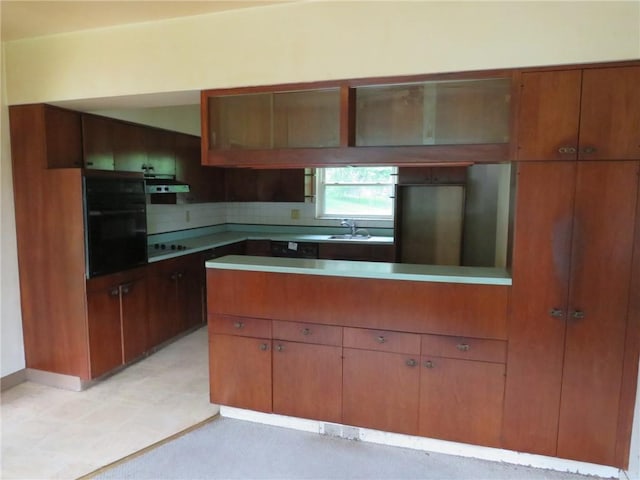 60 Wisetown Rd, Pa, PA 15022 - kitchen with oven, a peninsula, ventilation hood, stovetop, and brown cabinets