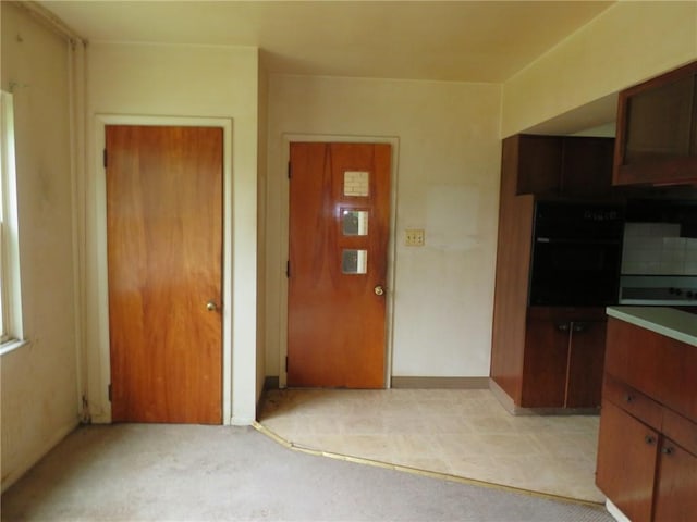 60 Wisetown Rd, Pa, PA 15022 - kitchen featuring black oven and light colored carpet