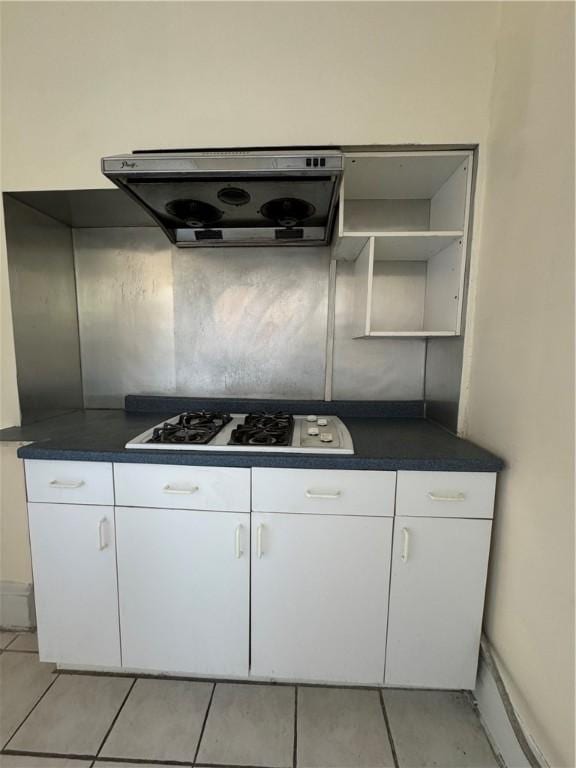 207 N Sprague Ave, Bellevue, PA 15202 - kitchen featuring extractor fan, white gas cooktop, dark countertops, and white cabinetry