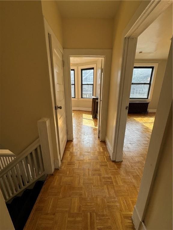 207 N Sprague Ave, Bellevue, PA 15202 - hall with plenty of natural light, radiator, and an upstairs landing