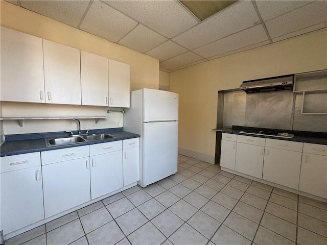 207 N Sprague Ave, Bellevue, PA 15202 - kitchen featuring ventilation hood, freestanding refrigerator, gas stovetop, dark countertops, and a drop ceiling