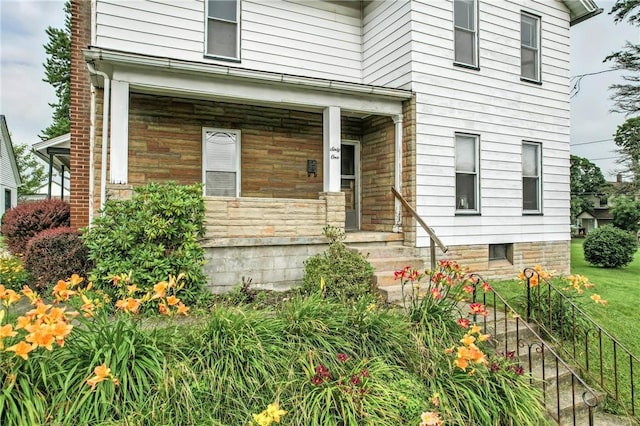 61 S 10th St, Sharpsville, PA 16150 - property entrance featuring a porch and stone siding