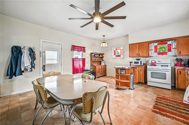 61 S 10th St, Sharpsville, PA 16150 - dining room featuring ceiling fan and healthy amount of natural light
