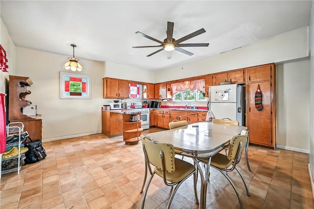 61 S 10th St, Sharpsville, PA 16150 - dining area featuring ceiling fan and baseboards