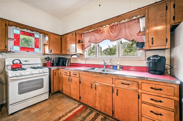 61 S 10th St, Sharpsville, PA 16150 - kitchen with gas range gas stove, healthy amount of natural light, brown cabinetry, and open shelves