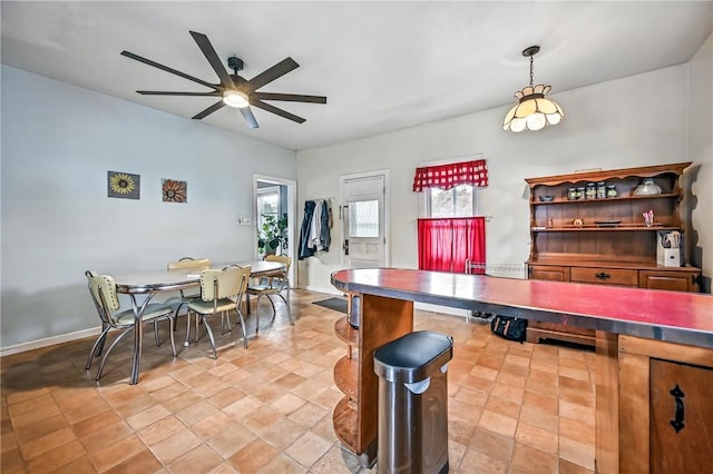 61 S 10th St, Sharpsville, PA 16150 - dining area featuring ceiling fan and light stone finish flooring