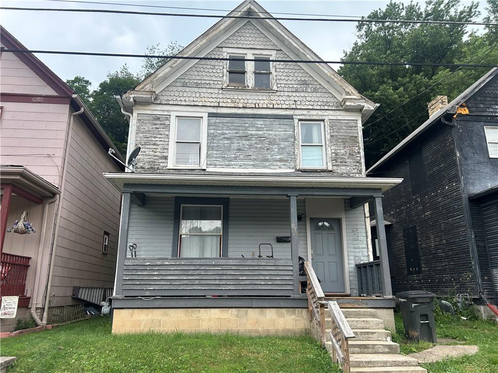 818 Grove Ave, New Brighton, PA 15066 - victorian house with a porch