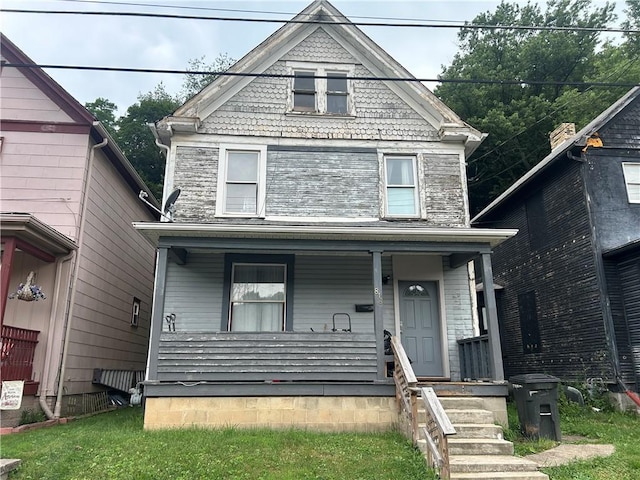 818 Grove Ave, New Brighton, PA 15066 - victorian house with a porch