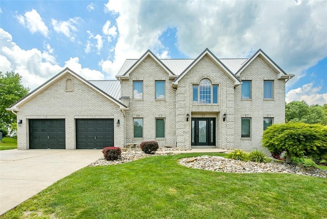 1007 Cicero Dr, Hempfield Twp, PA 15642 - view of front of property featuring concrete driveway, a front lawn, brick siding, and an attached garage