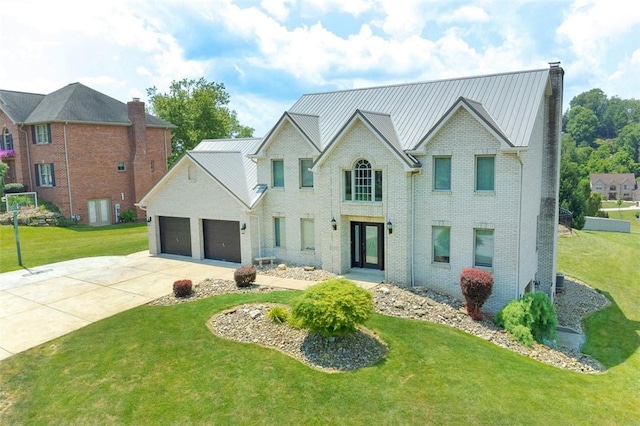 1007 Cicero Dr, Hempfield Twp, PA 15642 - view of front facade featuring concrete driveway, a front lawn, an attached garage, and a chimney