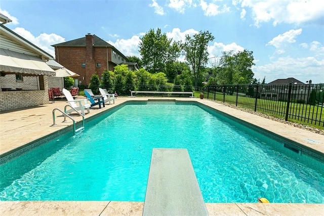 1007 Cicero Dr, Hempfield Twp, PA 15642 - view of swimming pool with a patio area, a fenced backyard, and a diving board