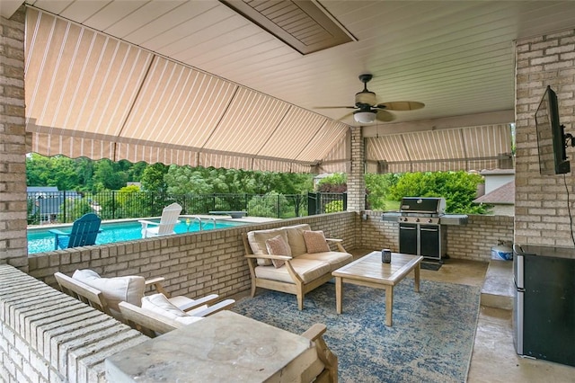 1007 Cicero Dr, Hempfield Twp, PA 15642 - fenced backyard with an outdoor hangout area, a patio, ceiling fan, and an outdoor kitchen