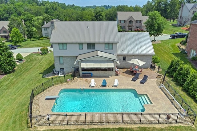 1007 Cicero Dr, Hempfield Twp, PA 15642 - rear view of property with a patio, a metal roof, and a fenced backyard