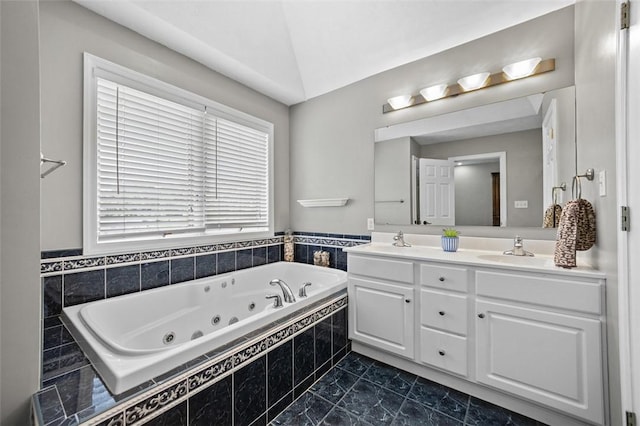 1007 Cicero Dr, Hempfield Twp, PA 15642 - bathroom featuring double vanity, a jetted tub, and vaulted ceiling