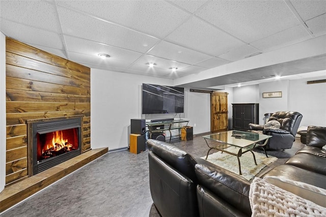 1007 Cicero Dr, Hempfield Twp, PA 15642 - living area with a drop ceiling, a fireplace, and wooden walls