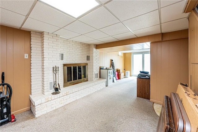 209 Farmbrook Dr, Hempfield Twp, PA 15601 - carpeted living room featuring a paneled ceiling, a fireplace, and a decorative wall