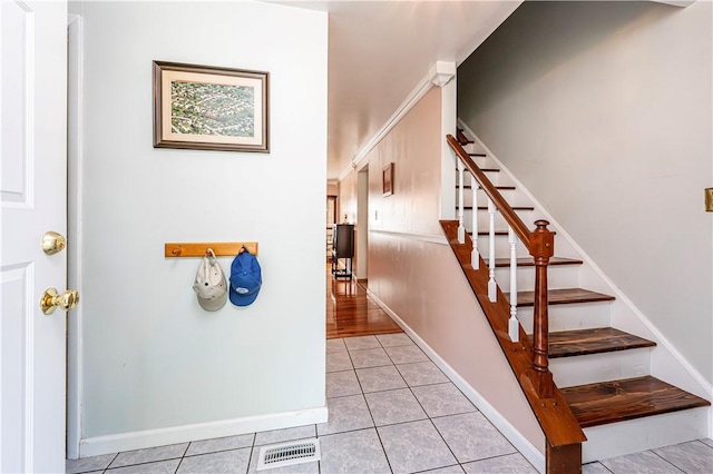 209 Farmbrook Dr, Hempfield Twp, PA 15601 - staircase featuring tile patterned floors and baseboards