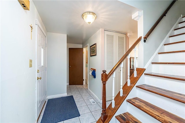 209 Farmbrook Dr, Hempfield Twp, PA 15601 - foyer entrance featuring light tile patterned floors and stairway