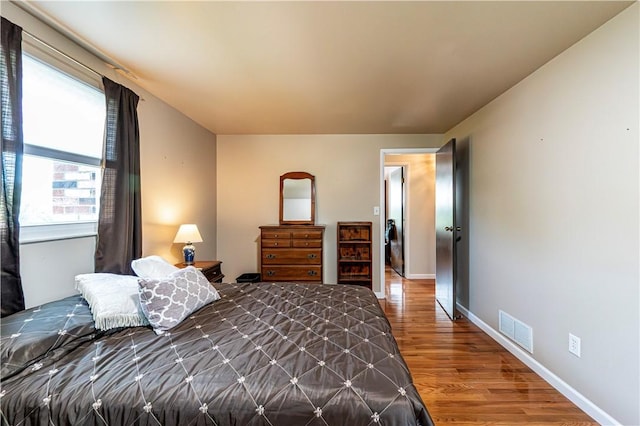 209 Farmbrook Dr, Hempfield Twp, PA 15601 - bedroom featuring wood finished floors and baseboards