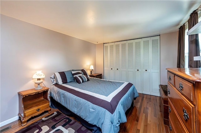 209 Farmbrook Dr, Hempfield Twp, PA 15601 - bedroom with dark wood finished floors and a closet