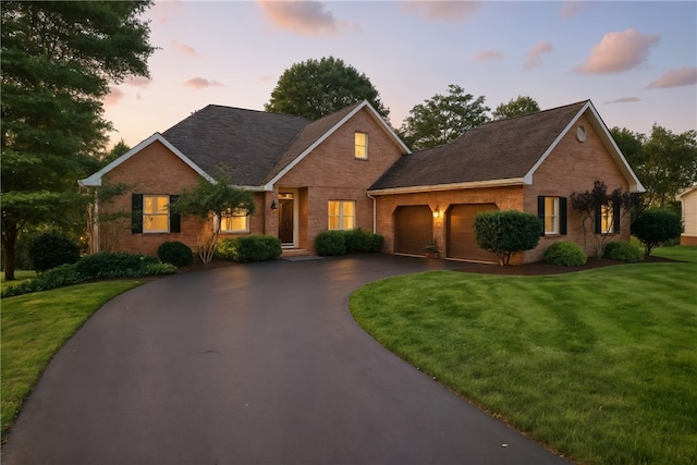 13 Kings Ln, Pine Twp, PA 16127 - ranch-style home featuring brick siding, a garage, driveway, and a lawn