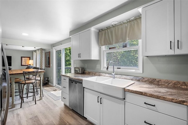 249 Duquesne Blvd, Plum Boro, PA 15068 - kitchen featuring dishwasher, light wood-style flooring, white cabinetry, and recessed lighting