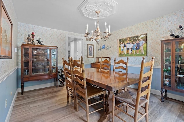 249 Duquesne Blvd, Plum Boro, PA 15068 - dining area with wallpapered walls, a chandelier, and light wood finished floors