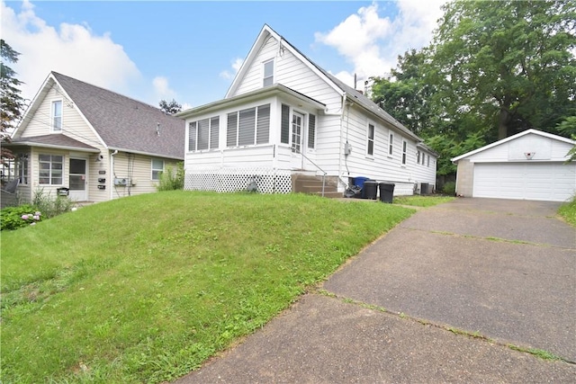 1323 Leaside Dr, Lincoln Place, PA 15207 - view of front of house featuring an outbuilding, a detached garage, a front yard, and entry steps