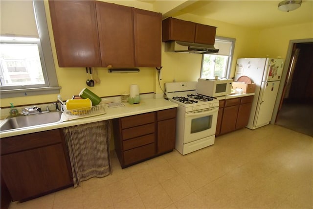 1323 Leaside Dr, Lincoln Place, PA 15207 - kitchen featuring white appliances, under cabinet range hood, and light countertops