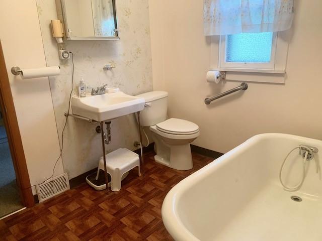 1323 Leaside Dr, Lincoln Place, PA 15207 - full bath featuring a freestanding tub and toilet