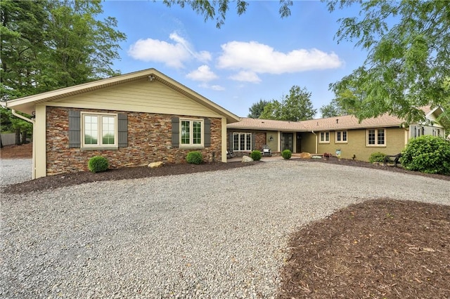 251 Myers Ln, Indiana Twp, PA 15101 - single story home with gravel driveway and stone siding