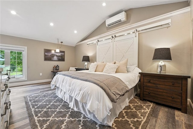 251 Myers Ln, Indiana Twp, PA 15101 - bedroom featuring a wall mounted air conditioner, a barn door, dark wood finished floors, vaulted ceiling, and recessed lighting