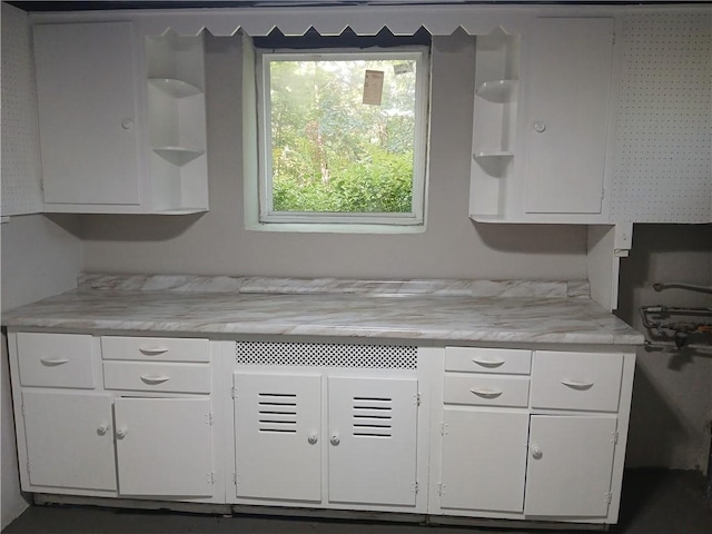 1211 Reed St, North Huntingdon, PA 15642 - kitchen with open shelves, white cabinetry, and light countertops