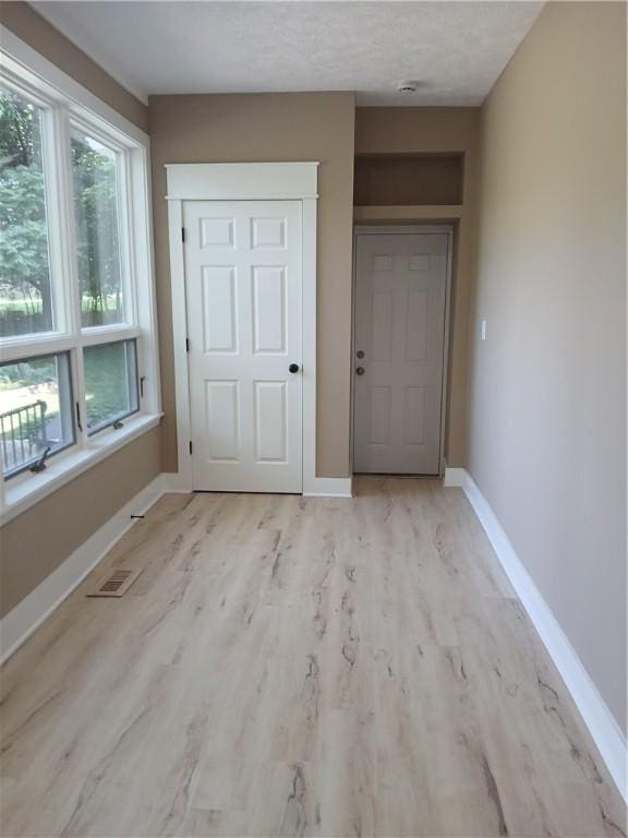 1211 Reed St, North Huntingdon, PA 15642 - foyer featuring light wood finished floors and baseboards