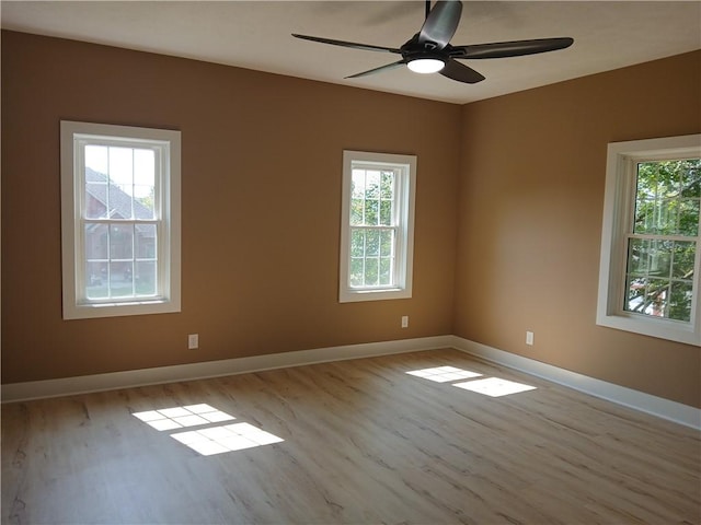 1211 Reed St, North Huntingdon, PA 15642 - spare room with wood finished floors, plenty of natural light, and ceiling fan