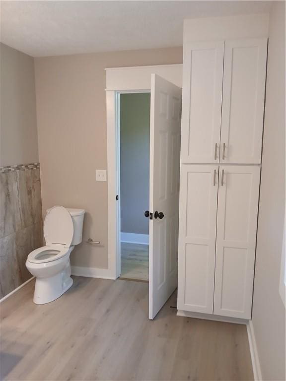1211 Reed St, North Huntingdon, PA 15642 - bathroom with toilet and wood finished floors