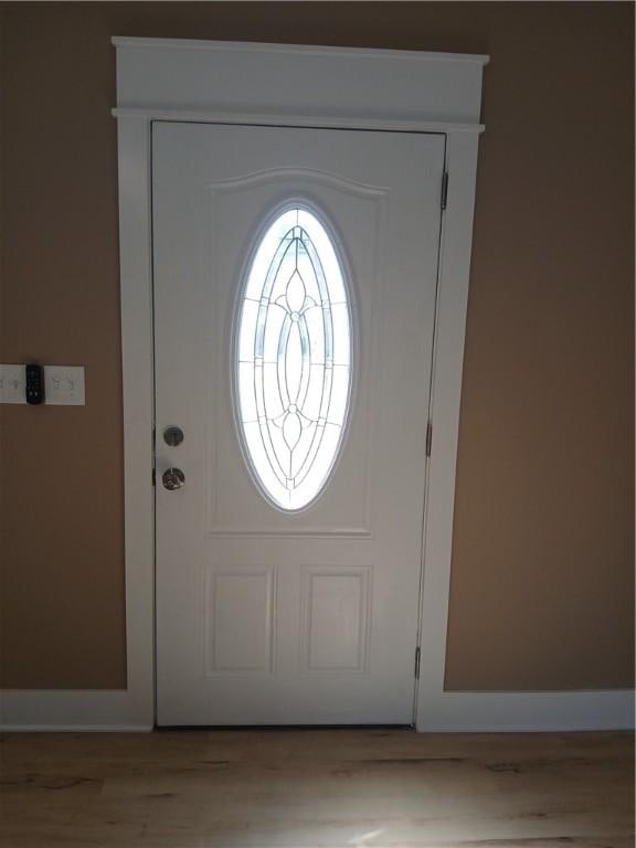 1211 Reed St, North Huntingdon, PA 15642 - foyer featuring baseboards and wood finished floors