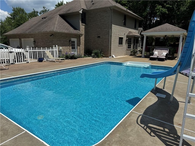 293 Sandy Hill Rd, Middlesex Twp, PA 16059 - view of swimming pool with outdoor lounge area, a water slide, a patio area, and a gazebo