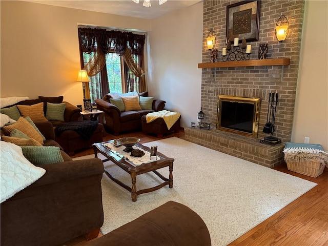 293 Sandy Hill Rd, Middlesex Twp, PA 16059 - living room featuring wood finished floors and a brick fireplace