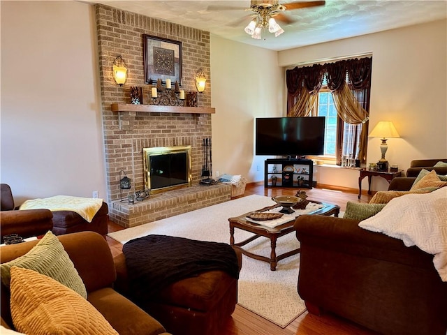 293 Sandy Hill Rd, Middlesex Twp, PA 16059 - living area with wood finished floors, ceiling fan, and a fireplace
